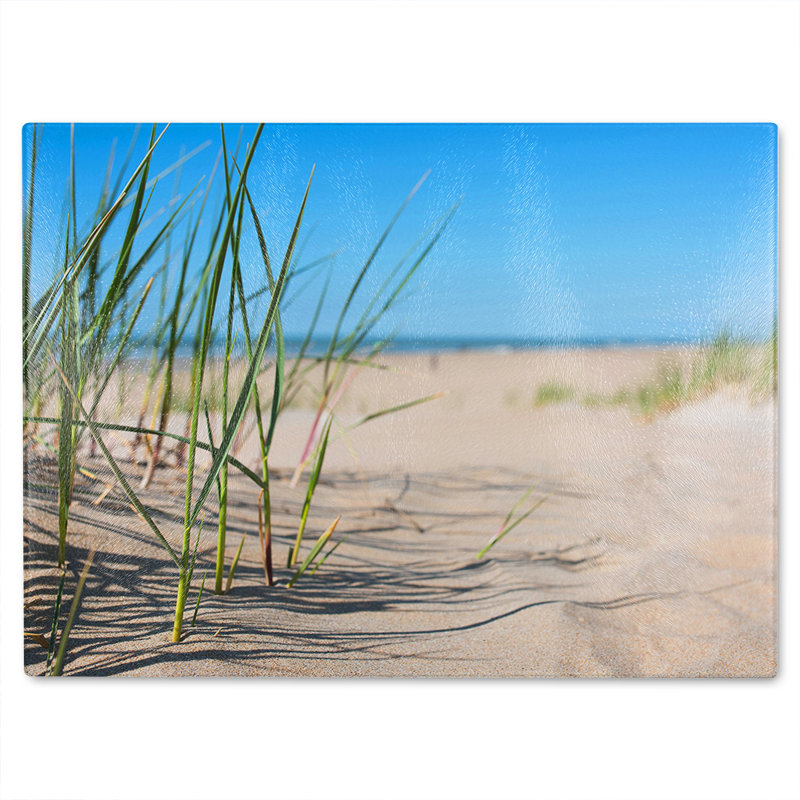Grass in the sand dunes with the lake in the background Designer Glass Chopping Board