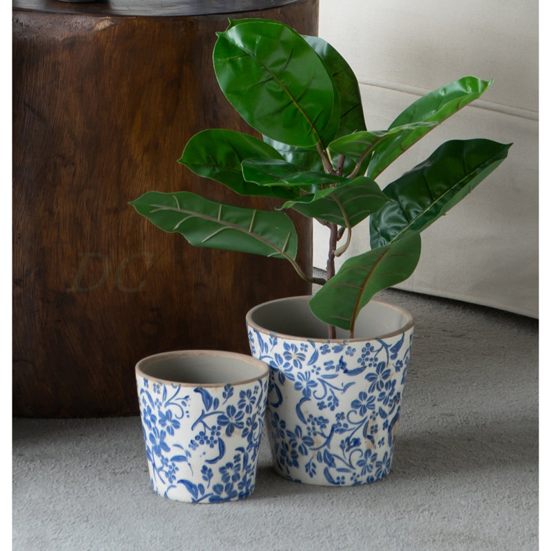 S / 2 jardinières en céramique bleue et blanche à motif floral