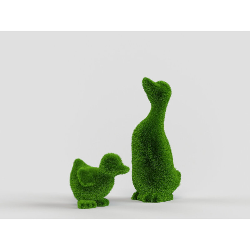 Personnage extérieur canard et topiaire vert