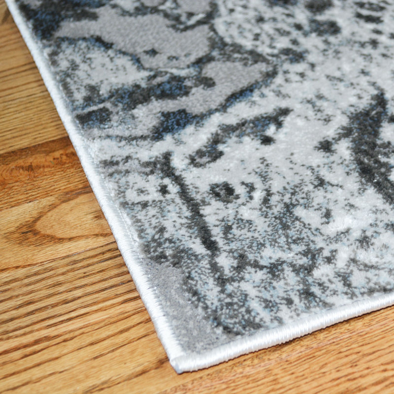 Tapis bleu abstrait Partughimeos, Rond 7 pi 10 po