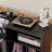Record Player Stand With Power Outlet & Flip-Down Lid, Turntable Table With Storage For 300+ Vinyls, Black Wood Grain Media Console With 2 Drawers, 27.6" With Dust Protection, Some Assembly Required,