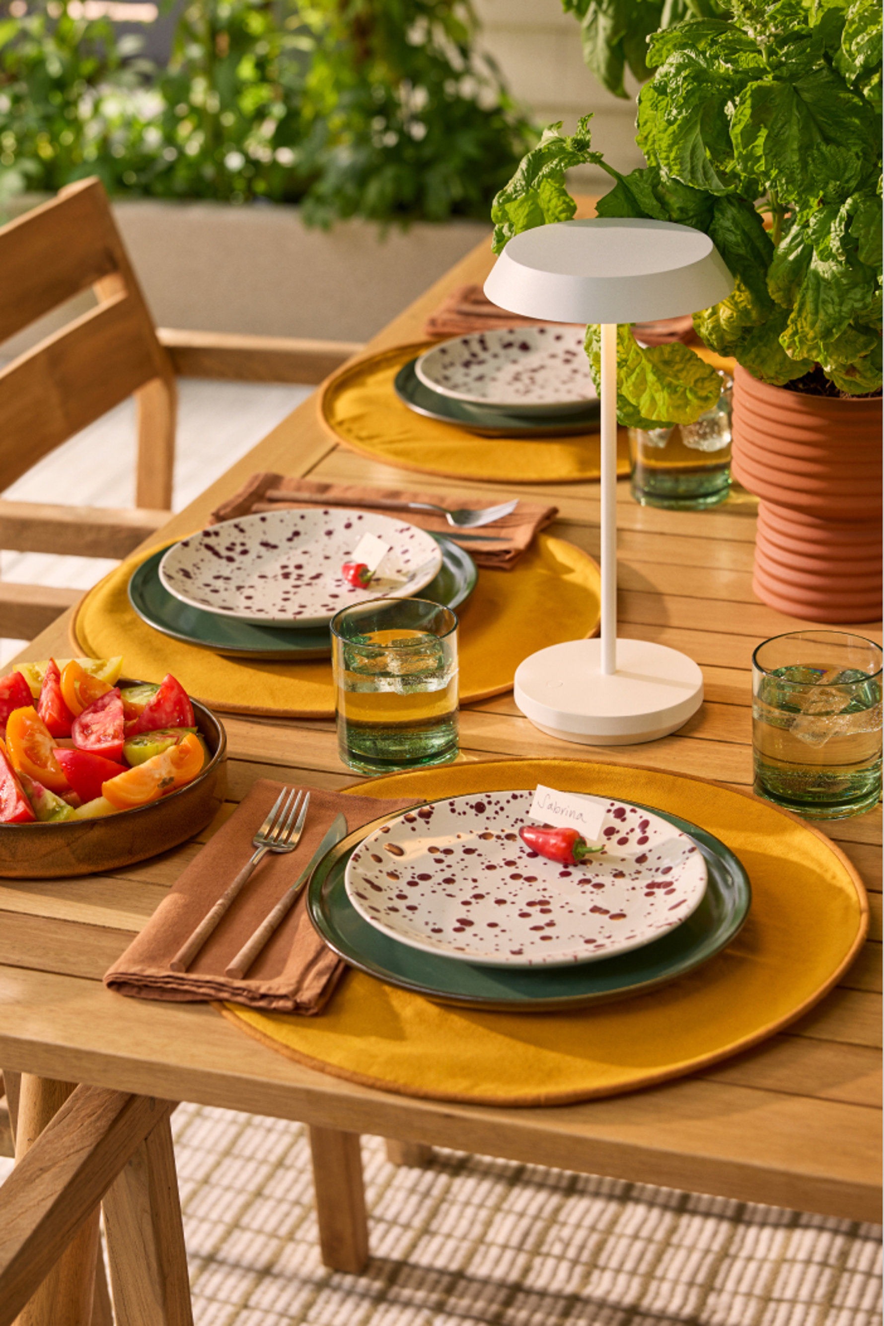 Outdoor table setting with place cards that read, Sabrina.