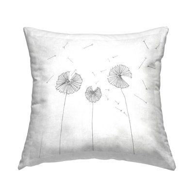 Design de coussin décoratif blanc à motif de pissenlit à motif de graines de vol blanches par Cloverfield & Co.