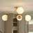4-Light Iron Flush Mount Ceiling Light with Frosted Glass Globes