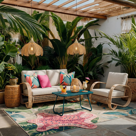 Tropical outdoor seating area with wicker furniture.