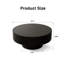 Table basse ronde avec relief fabriqué à la main et piédestal robuste, parfaite pour les salons modernes et élégants