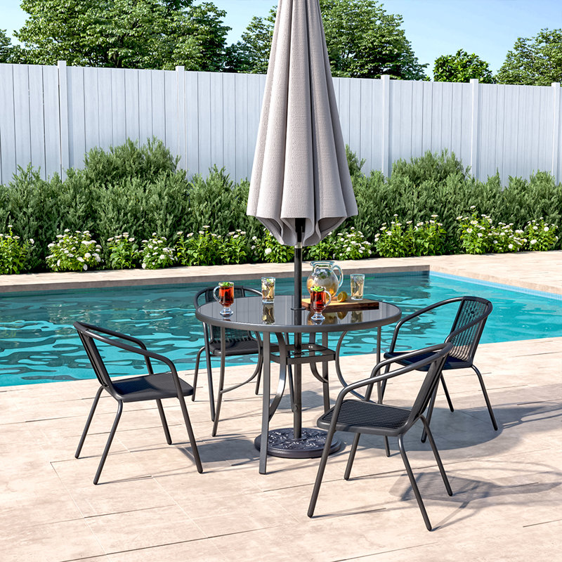 Mclin 4 - Person Patio Dining Set with Round Table , Cushions Included
