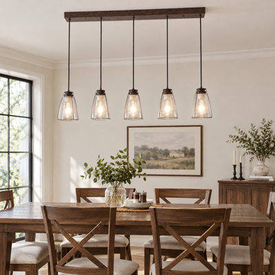 Lustre linéaire à 5 lumières avec abat-jour en verre bullé, idéal pour îlot de cuisine ou salle à manger.
