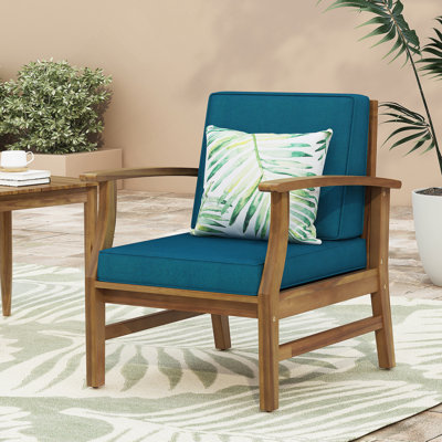 Fauteuil club confortable en bois d'acacia avec coussin résistant à l'eau pour la détente