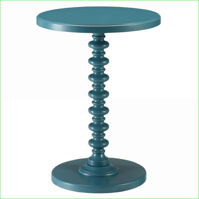 Table basse ronde en bois massif rouge, peu encombrante pour une surface pratique