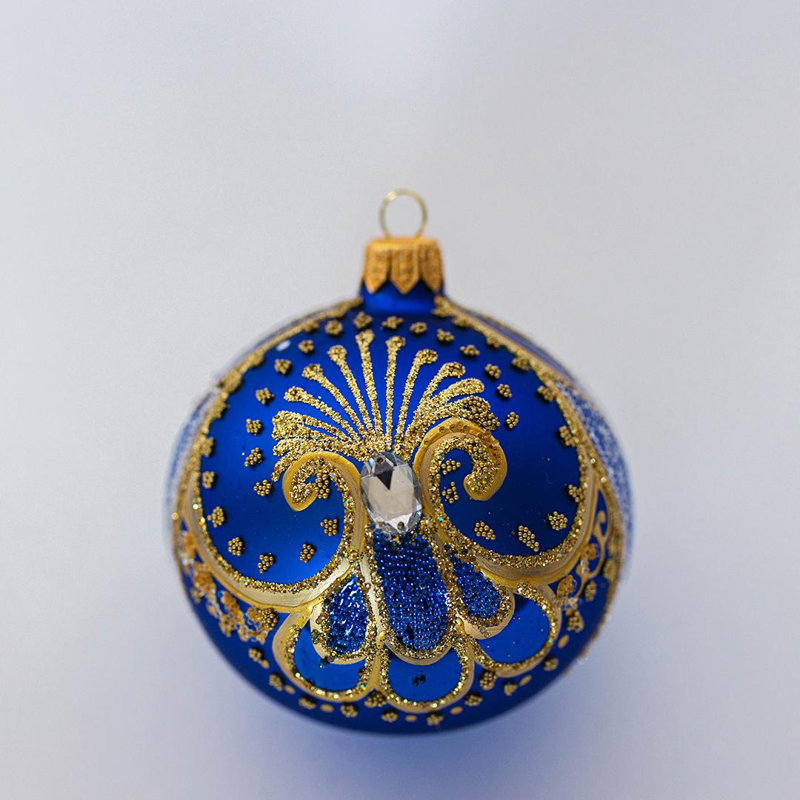 Motif doré avec ornement boule de perles transparentes