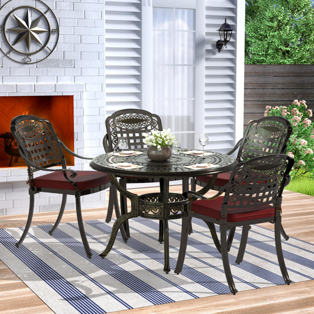 4 - Person Metal Patio Dining Set with Round Table , Cushions Included Charlton Home® Cushion 