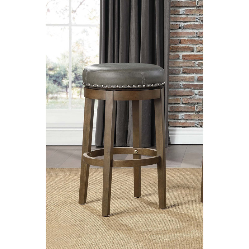 Ensemble de 2 tabourets de bar rotatifs ronds, similicuir gris, siège pivotant à 360 degrés, garniture cloutée, structure en bois massif, finition brune