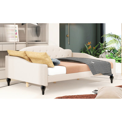 Lit de jour beige avec rembourrage en mousse et capitonnage à boutons profonds - construction moderne - pieds