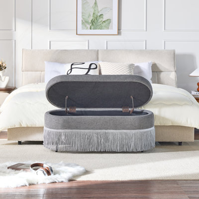 Oval Upholstered Storage Ottoman with Fringe Trim & Lift-Top Lid - Multi-Functional Footrest & Hidden Storage for Living Room or Bedroom, Grey Fabric with Metal Frame