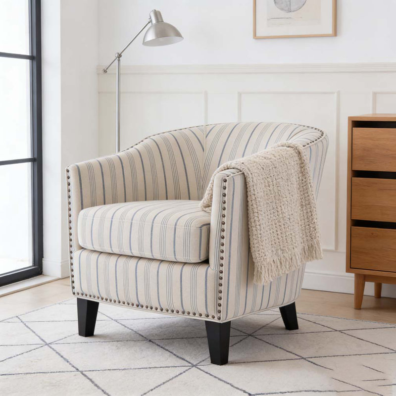 Fauteuil demi-tonneau rembourré à rayures