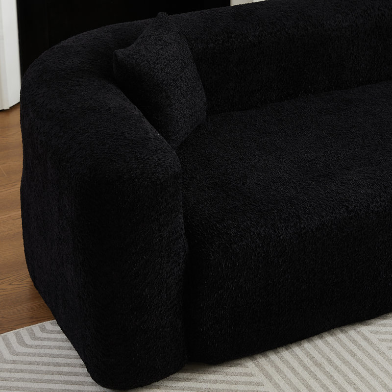 Canapé modulaire modulaire en L avec dossier incurvé, tissu chenille et confort moelleux pour les espaces de vie modernes.