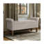 Banc de rangement rembourré beige avec siège rabattable, accoudoirs arrondis et pieds en bois massif