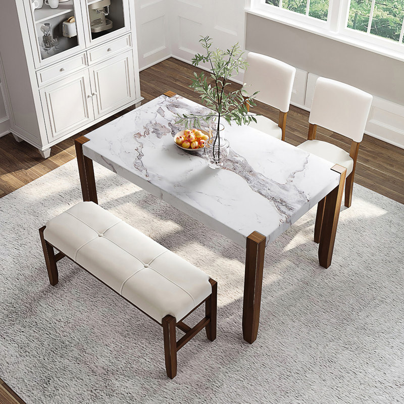 Ensemble de mobilier de salle à manger moderne 4 pièces avec table en faux marbre et conception compacte, parfait pour les repas de famille et une utilisation polyvalente.