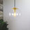 Luminaire suspendu moderne avec globe réglable en verre pour espaces de vie contemporains