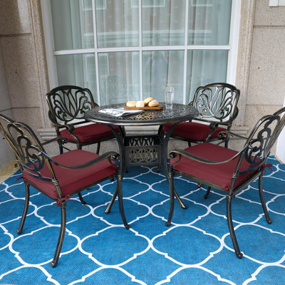 4 - Person Patio Dining Set with Round Table , Cushions Included