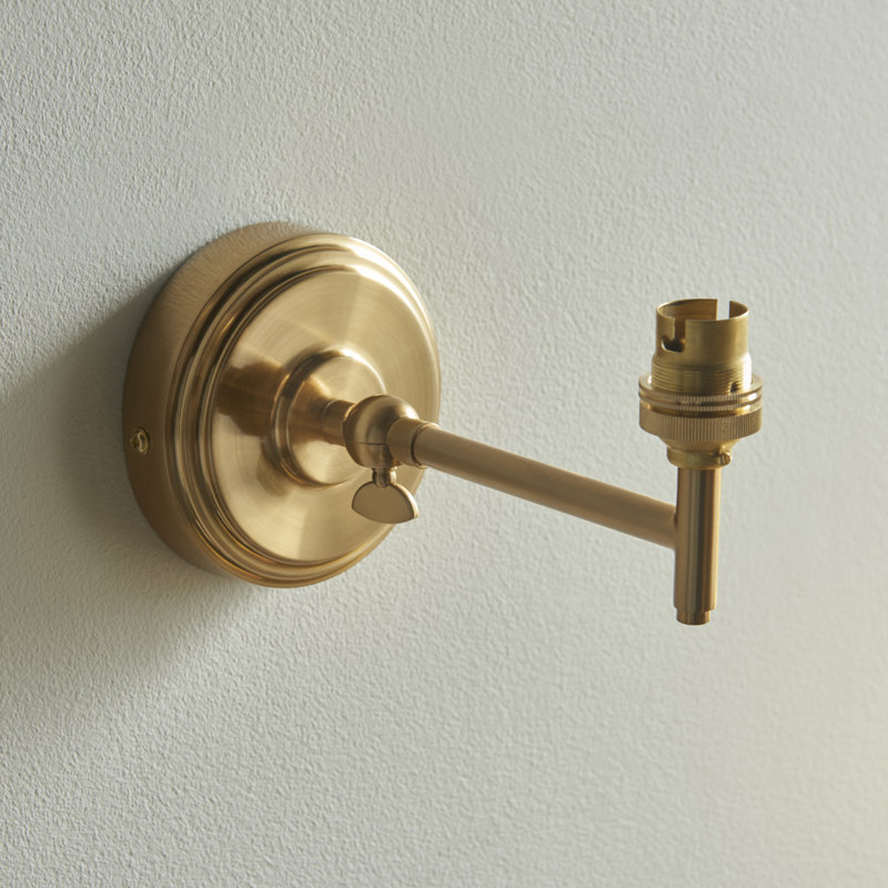 Step Fold Wall Fitting finished in Br Aged Brass