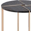 La table de jardin noire champagne ajoute du charme à l'espace extérieur