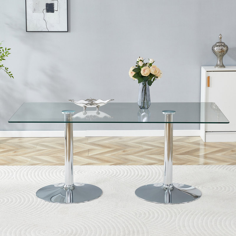 Un plateau de table en verre de 71 x 35,4 pouces et une table de salle à manger circulaire minimaliste moderne avec des pieds en métal argenté électrolytique. Convient aux restaurants et aux salons.