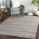Tapis noir / blanc tissé à la machine