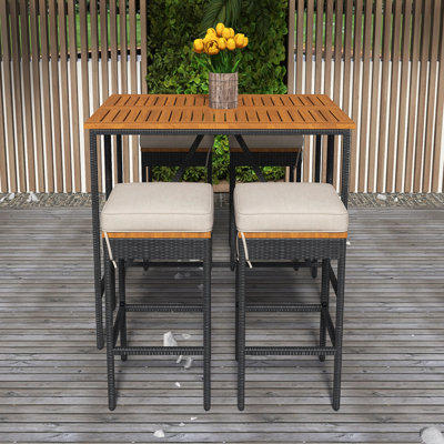 5-Piece Outdoor Acacia Wood Bar Height Table And Four Stools With Cushions, Garden PE Rattan Wicker Dining Table, Foldable Tabletop, High-Dining Bistro Set