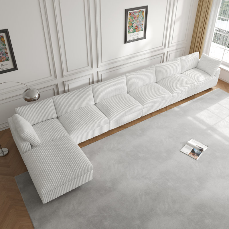 Canapé modulaire rembourré avec repose-pieds 7 pièces 7 pièces, Fausse fourrure beige Ricoeur