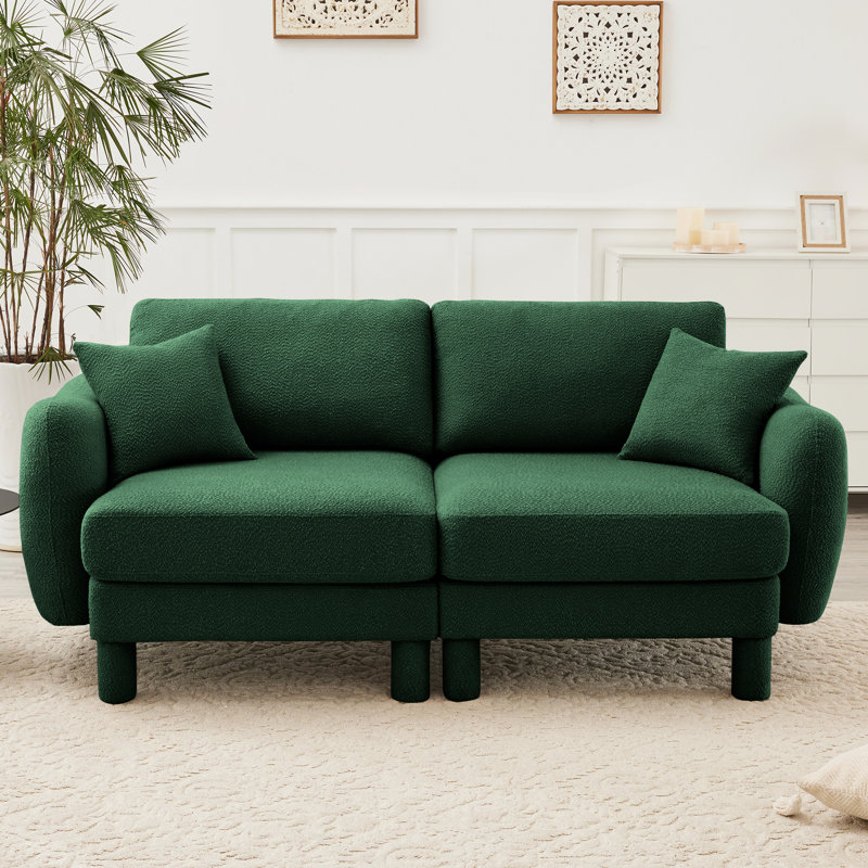 Canapé 2 places en tissu bouclé, design moderne et confortable, idéal pour toute la famille. Sa construction robuste et son revêtement doux vous garantissent des moments de détente.