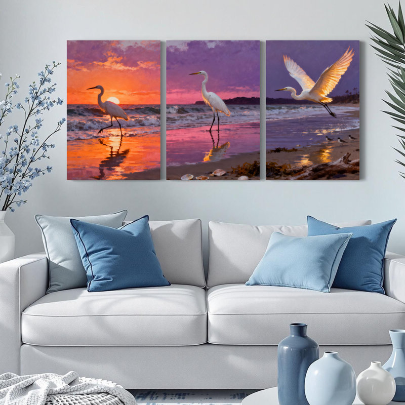 Ensemble de 3 tableaux sur toile tendue représentant un héron au coucher du soleil, H 18 po x l 36 po
