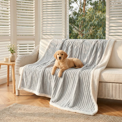 Water-Resistant Pet Blanket. Gentle, Calming Dog Blanket. Cozy, Calming Sherpa Fleece Blanket. Reversible Furniture Protector Cover. Suitable for Small, Medium, and Large Dogs and Cats. Machine Washable. Color: Grey. Dimensions: 30x40 Inches.