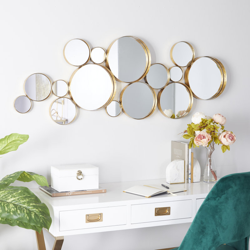 Miroir mural rond en métal doré