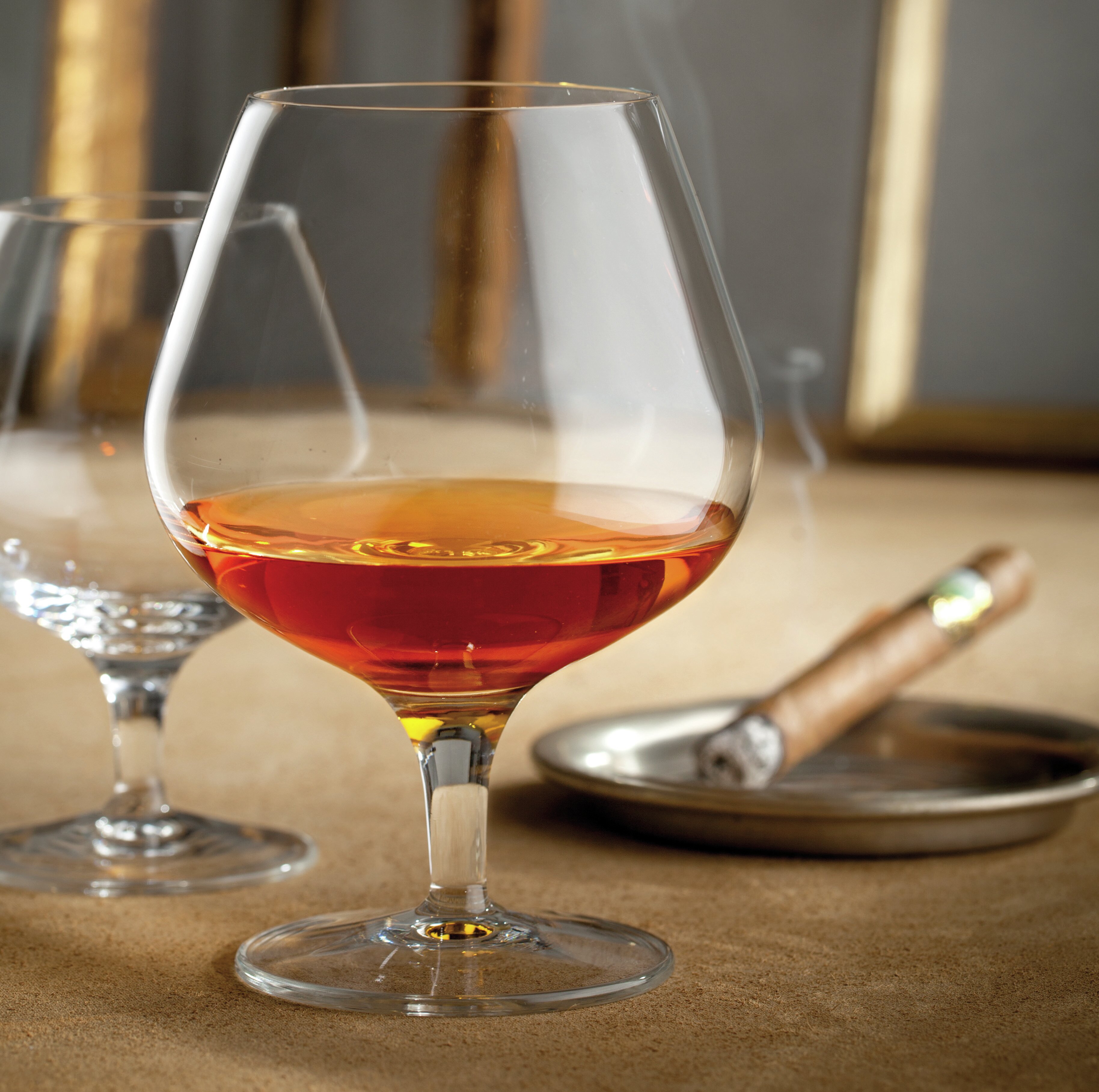 https://assets.wfcdn.com/im/66431052/compr-r85/6907/69079207/luigi-bormioli-michelangelo-masterpiece-1325-oz-cognac-glasses.jpg