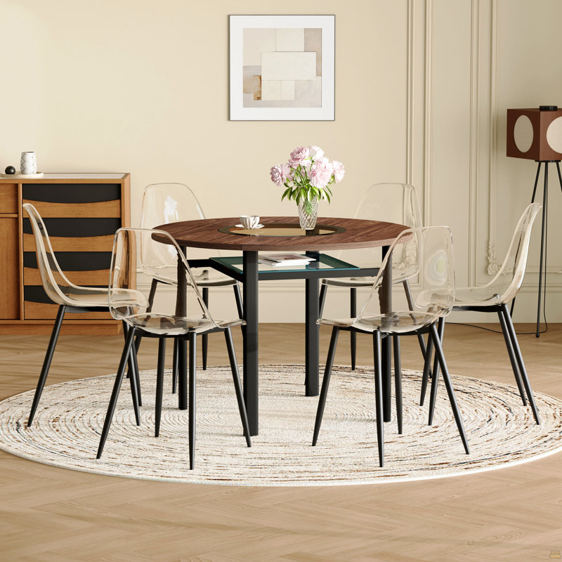 Ensemble table et chaises. Table de salle à manger ronde de 107 cm (42 pouces), style minimaliste moderne, fini bois brun. Comprend 6 chaises en plastique transparent avec pattes en métal noir. Pour un confort optimal à la maison.