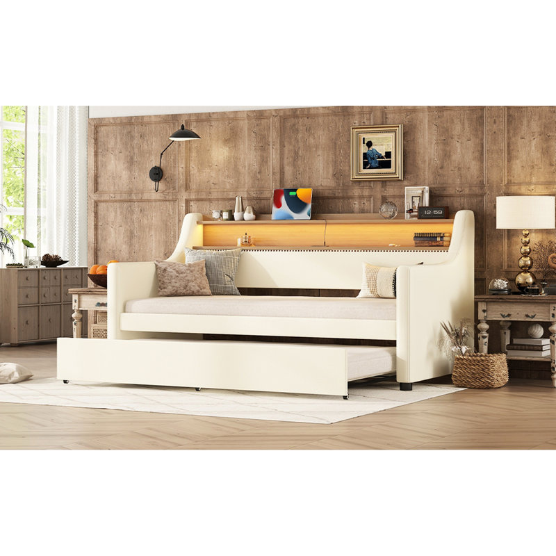 Lit de jour simple avec lit gigogne, rembourré en blanc, charge et effets d'éclairage à DEL pour une chambre à coucher confortable