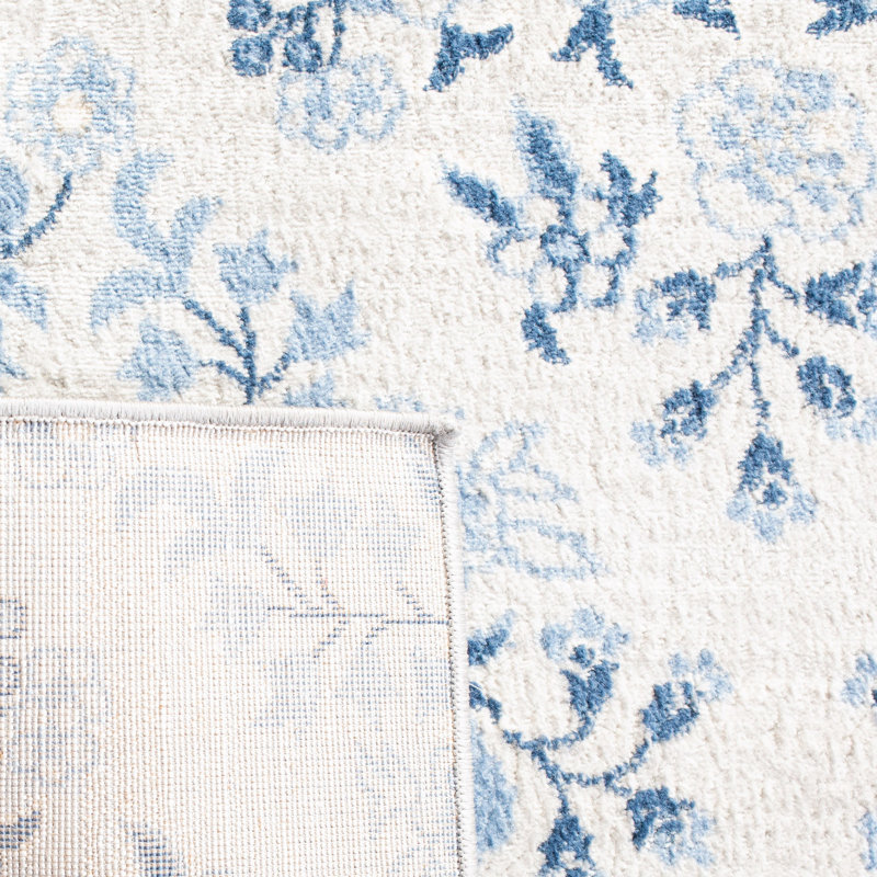 Blue and Cream Floral Synthetic 11' x 15' Area Rug