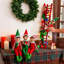 Décorations de Noël : lutin sur une échelle rouge illuminée de mille feux, figurine de lutin festive pour la maison, le foyer, la table et les étagères.