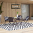 Janaysha 4 - Person Wicker Patio Dining Set with Round Table , Cushions Included