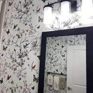 The birds  butterflies wallpaper from schumacher1889 makes this guest  bath a stand out The darker design elements in the vanity cabinet   Instagram
