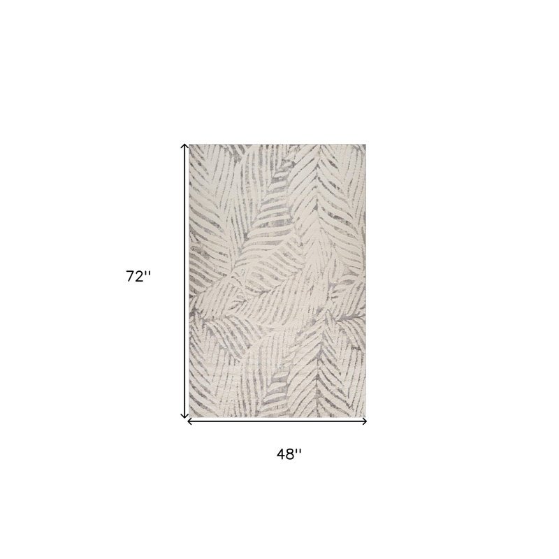 Tapis gris et crème 4 pi x 6 pi à feuilles botaniques