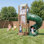 Ensemble de balançoire à glissière Turbo Tube pour jeu de plein air pour enfants, tout-en-1 avec échelle d'escalade, bac à sable et panier de basketball pour 3 à 8 ans