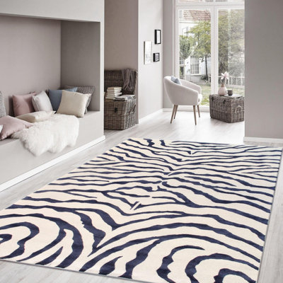 Tapis ivoire / bleu marine en laine / soie à motif animal fait à la main 5 pi x 8 pi