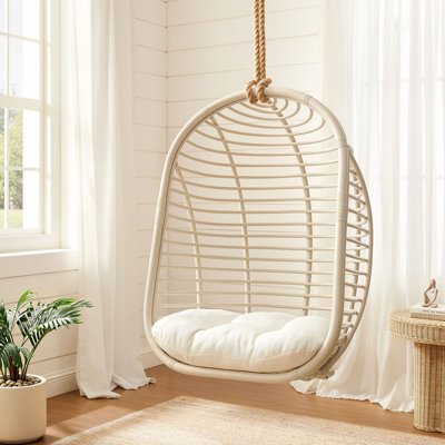 Fauteuil suspendu Neve en rotin naturel à tissage ajouré, couleur beige pâle