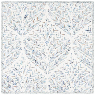 Tapis ivoire / bleu en laine touffeté à la main Ikat