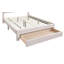 Lit plateforme avec tiroir de rangement sous le lit