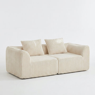 Minimalist Curved Sofa with Sloped Backrest & Horn-Shaped Throw Pillows