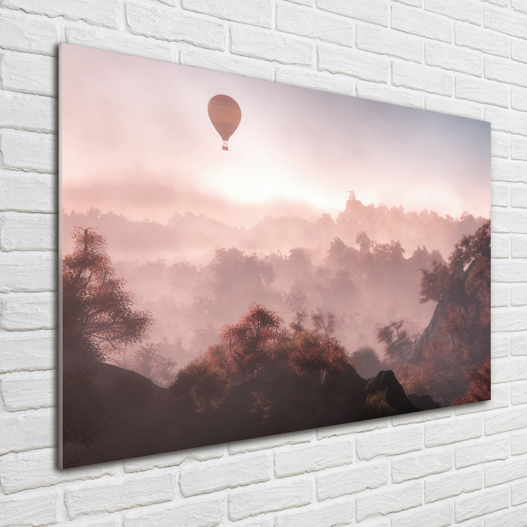 Glasbild Luftballon über dem Wald